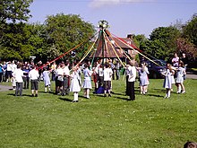 Children dancing around a maypole as part of a May Day celebration in Welwyn, England Maypole Dancing on Village Green - geograph.org.uk - 1628839.jpg