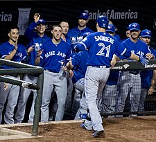 Michael Saunders celebrates with teammates after hitting his third home run in a game against the Baltimore Orioles on June 17. Michael Saunders three home runs.jpg