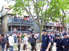 People and police officers at the Mifflin Street Block Party in Madison, Wisconsin in 2007 Mifflin Street Block Party.png