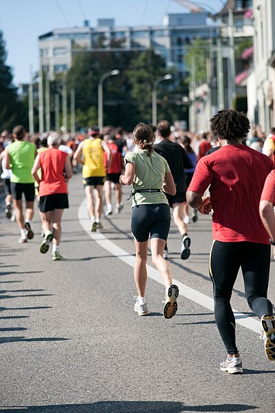 A group of amateur runners in a long-distance race in Switzerland.