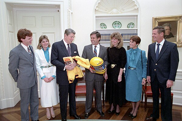 Unser (center, holding helmet) visiting United States president Ronald Reagan in January 1986 along with his wife Karen, his brother Bobby Unser and h