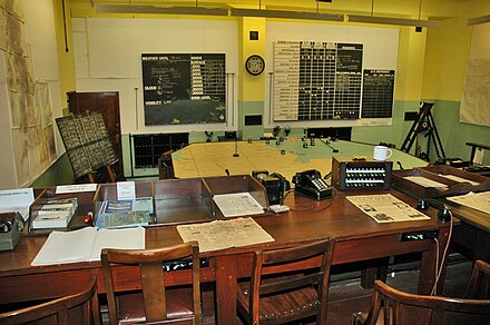 RAF Digby Sector Operations Room, sector clock with inward-pointing segments on wall RAF Digby Ops Room.jpg