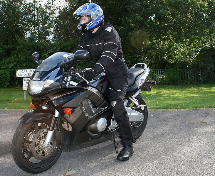 File:Rider in black textile suit and blue helmet on Honda CBR600.jpg