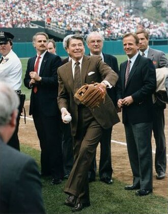 Ueberroth (front right) watches President Ronald Reagan throw the first pitch prior to a game at Memorial Stadium in Baltimore.