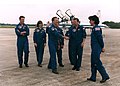 STS-71 crew greet each other after arrival.jpg