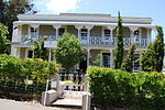 This double-storeyed house was built in 1853 in the Cape Georgian style and victorianised in the late-nineteenth century by the addition of a cast-iron verandah on both levels. The outbuildings, consisting of the original coach house and what is believed. Schoone Oordt.JPG