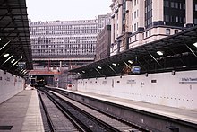 St Paul's Thameslink station shortly after opening, with the remains of Holborn Viaduct railway station in the background St Pauls Thameslink station (1990).JPG