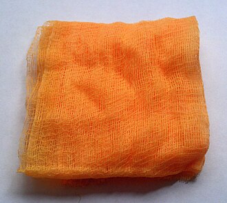 A tack cloth made of gauze impregnated with a tacky material Tack cloth.jpg