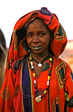 Niger has the highest total fertility rate in the world. Termitwoman.jpg