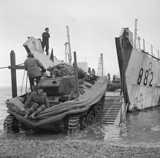 A Valentine DD tank being loaded onto a landing craft prior to a training exercise, Stokes Bay, Hampshire, January 1944