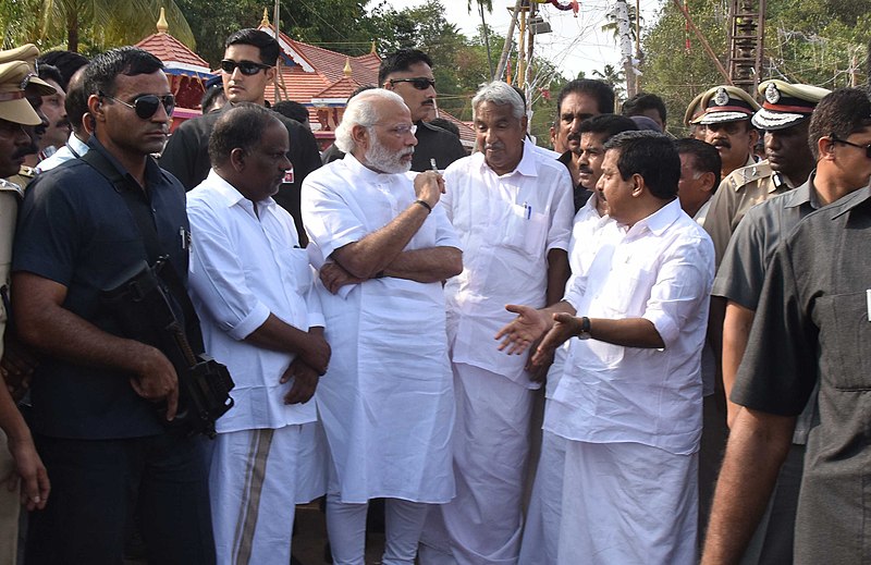 File:The Prime Minister, Shri Narendra Modi and the Chief Minister of Kerala, Shri Oommen Chandy, takes stock of the situation at Puttingal temple, Paravur, in Kollam, Kerala on April 10, 2016 (2).jpg