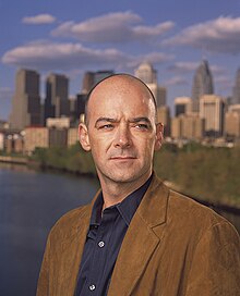 Todd Carmichael, La Colombe founder, with the Philadelphia skyline, 2002 Todd carmichael la colombe.jpg
