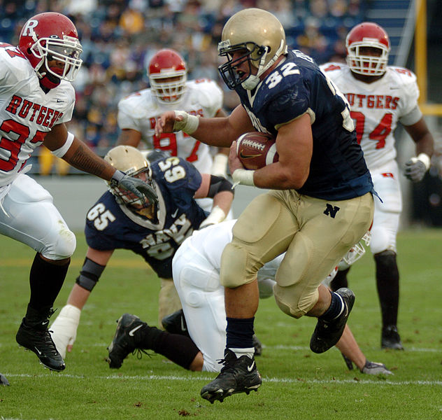 File:US Navy 041120-N-9693M-009 U.S. Naval Academy Midshipman 1st Class Kyle Eckel breaks through a line of Rutgers University defenders enroute to a touchdown in the 1st quarter.jpg