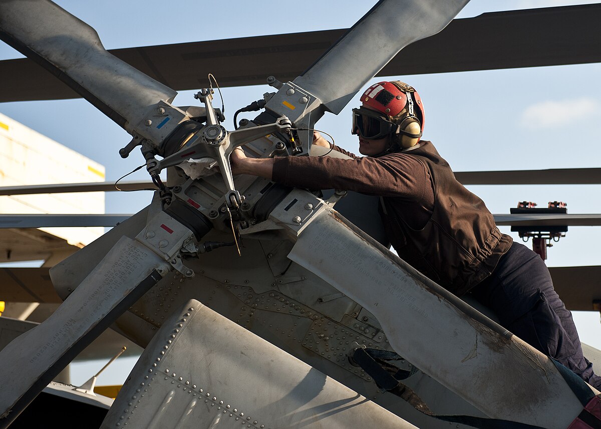 File:US Navy 111130-N-BT887-003 A Sailor wipes the tail rotor of an MH-60R Sea Hawk helicopter assigned to the Raptors of Helicopter Maritime Strik.jpg - Commons