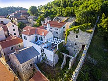 Vlatkovic (Kontin's) palace is located within the historic center of Novigrad, just above the Great (city) gate along the eastern rampart. The yard is a set of residential and commercial buildings with a water cistern and terraced gardens. It was extended several times in the period from the 17th to the 19th century. The last extensive reconstruction of the complex was carried out in 1813, when Canon Pave Vlatkovic built a cistern and decorated the residential buildings in the forms of classicism. Vlatkovica (Kontinov) dvor.jpg