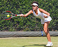 Yang Zhaoxuan competing in the second round of the 2015 Wimbledon Qualifying Tournament at the Bank of England Sports Grounds in Roehampton, England. The winners of three rounds of competition qualify for the main draw of Wimbledon the following week.