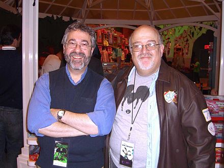 David with Warren Spector at the November 30, 2010 Times Square Disney Store launch party for Epic Mickey, which Spector designed, and for which David wrote two tie-in products