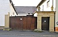 Courtyard gate with vase attachments