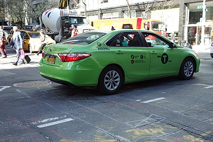 A borough taxi, which can be identified by its light green color