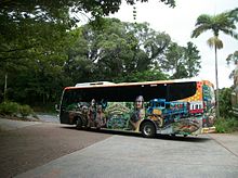 A colourful tour bus at Kuranda, Queensland, Australia A tour Bus at Rainforestation Cairns.JPG