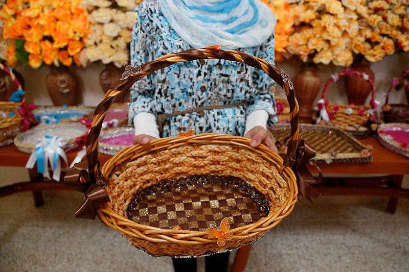 File:A young Syrian refugee girl in Lebanon shows a basket that she’s just learnt how to make and decorate at a UNICEF vocational training session supported by UK aid. (14496181410).jpg