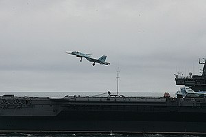 Aircraft is landing on the carrier.jpg