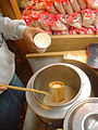 Japanese amazake – fermented rice milk – served from a ladle