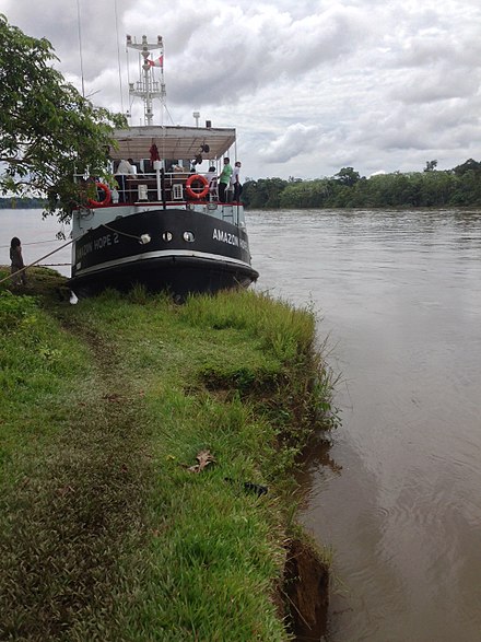 Amazon Hope 2, moored outside a rural village in Loreto, Peru. Amazon Hope Boat moored outside Peruvian village.jpg