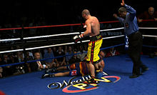 Anthony Mundine stands over Bronco McKart on Fight Night, July 14, 2012 Anothy Mundine stands over Bronco McKart on July 14th, 2012 during WealthTV's "Fight Night".jpg