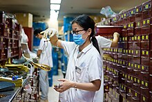 Apothecary mixing traditional chinese medicin (中药房) at Jiangsu Chinese Medical Hospital in Nanjing 南京, China (34326619184).jpg