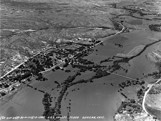 Aerial view of Duncan during the mid-20th century, showing US 70 heading east towards New Mexico