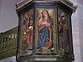 Jomfruen og Barnet flankeret af hellige biskopper, såsom Sankt Hieronymus og Sankt Augustin, på prædikestolen i Balingen-kirken.