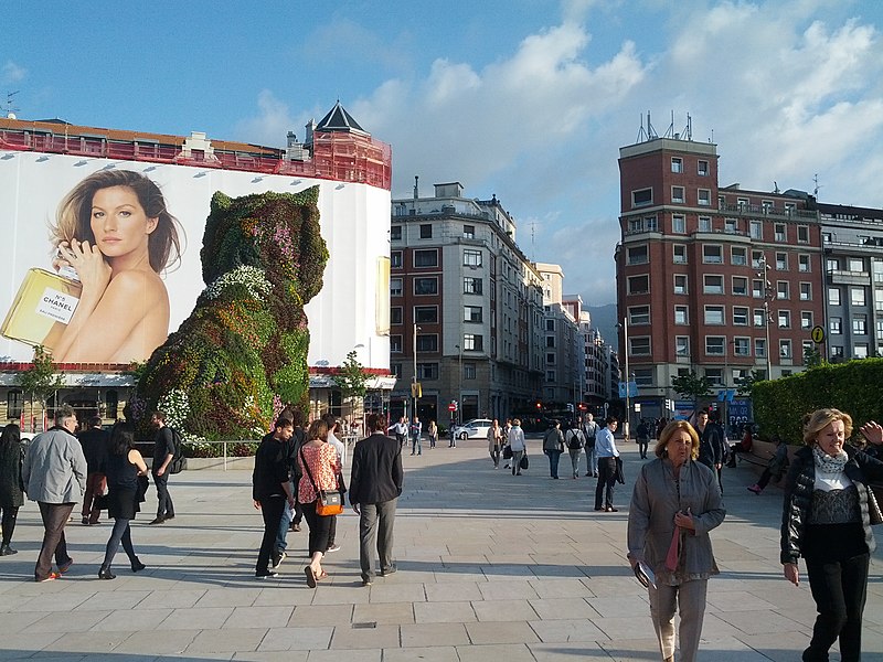 File:Billboard, back of puppy, and city from Guggenheim (18186459124).jpg