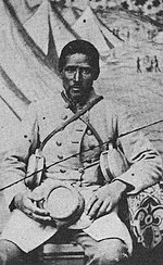 Marlboro Jones, an African-American servant to a white Confederate soldier. African Americans performed forced labor under Confederate military unit direction. Black Confed-1.JPG