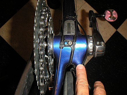 Black plastic cable guide on the bottom of a Trek 5000 bottom bracket shell Cable guide 2.JPG