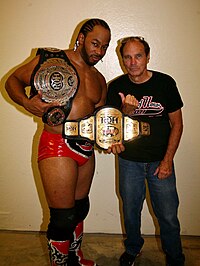 Lethal is a two-time ROH Television Champion (left hand), and two-time ROH World Champion (over shoulder) Champion Jay Lethal.jpg