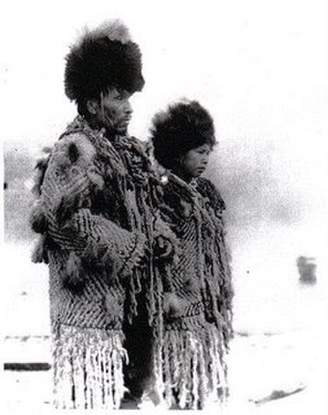 Chief George from the village of Senakw with his daughter in traditional regalia, c. 1906