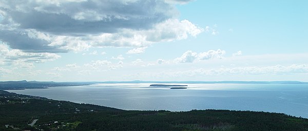 View of Conception Bay, looking southwest from Portugal Cove 47°36.50′N 52°51.34′W / 47.60833°N 52.85567°W / 47.60833; -52.85567 towards Holyrood. The