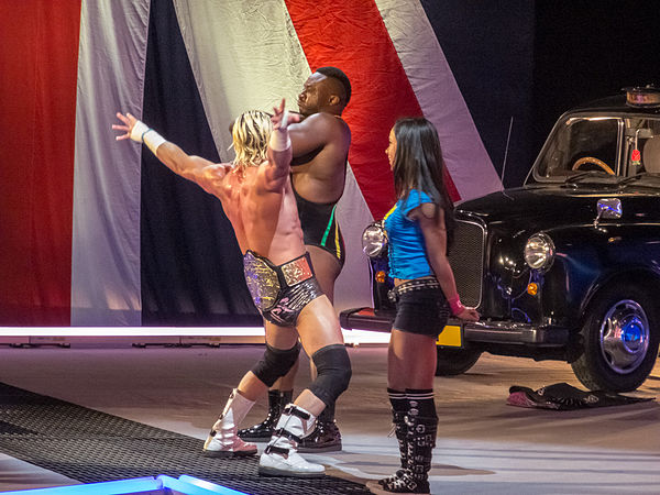 Langston (back) with World Heavyweight Champion Dolph Ziggler (center) and their manager AJ Lee (foreground) in April 2013