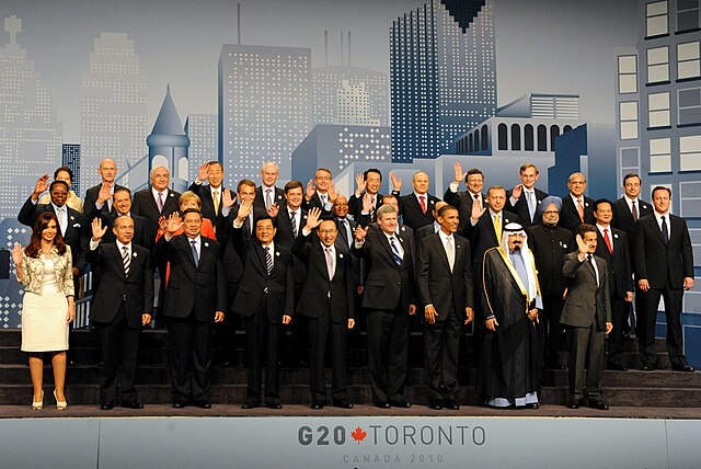 Leaders pose for a group photo at the Metro Toronto Convention Centre