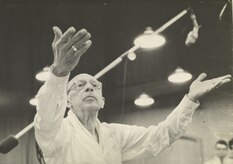Black and white photo of Stravinsky conducting in a recording studio