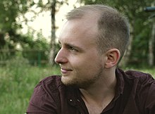 Portrait photo of the director Jakob Schmidt