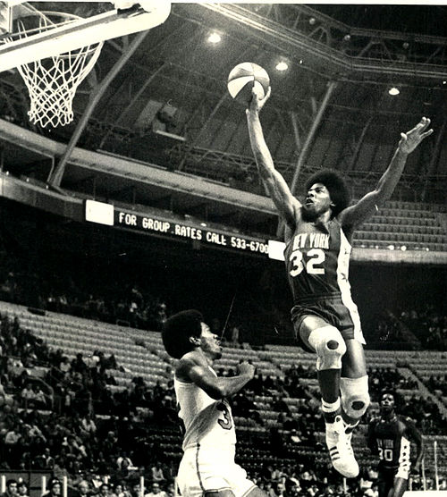 Julius Erving performing a slam dunk against the Spirits of St. Louis, 1974