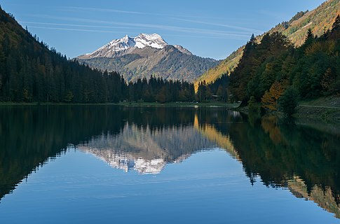 View of Roc d'Enfer from Lac de Montriond in commune of Montriond, Haute-Savoie, France