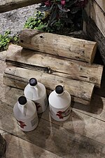 Thumbnail for File:Maple Syrup Bottles and Logs - Norfolk Country, Ontario.jpg