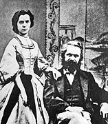 Marx's daughter Jenny Longuet standing and Karl Marx seated - photograph.jpg