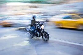 Motorcyclist in Midtown Manhattan-L1002704.jpg