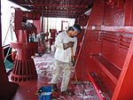 Ordinary-seamen-swabbing-deck.JPG