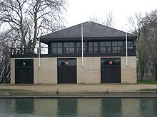 St Anne's boathouse (centre) on The Isis, shared with St Hugh's College and Wadham College Oxford boathouse 1.jpg