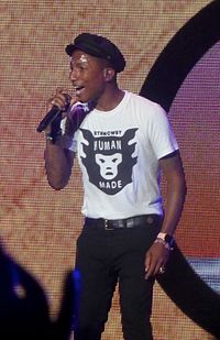 Pharrell Williams had the best-selling single of 2014 with "Happy", taken from the soundtrack of Despicable Me 2, which first entered the top 10 in December 2013, peaked at number-one on 4 January 2014, and spent 20 weeks in the top 10 altogether. Pharrell Williams - performing - summersonic - aug 16 2015.jpg